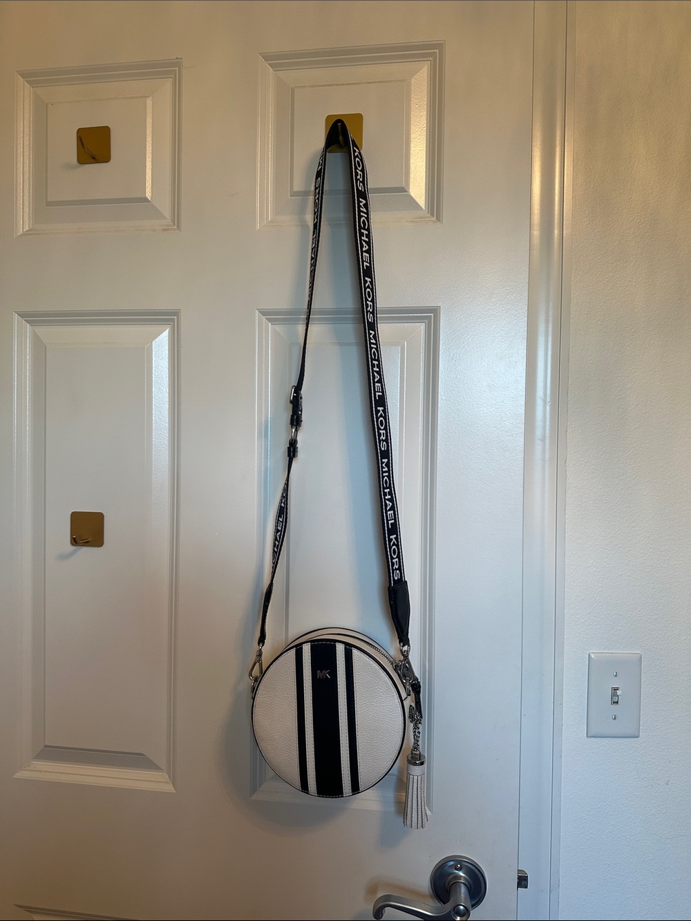 Michael Kors White Round Crossbody with Black Stripes and Branded Strap